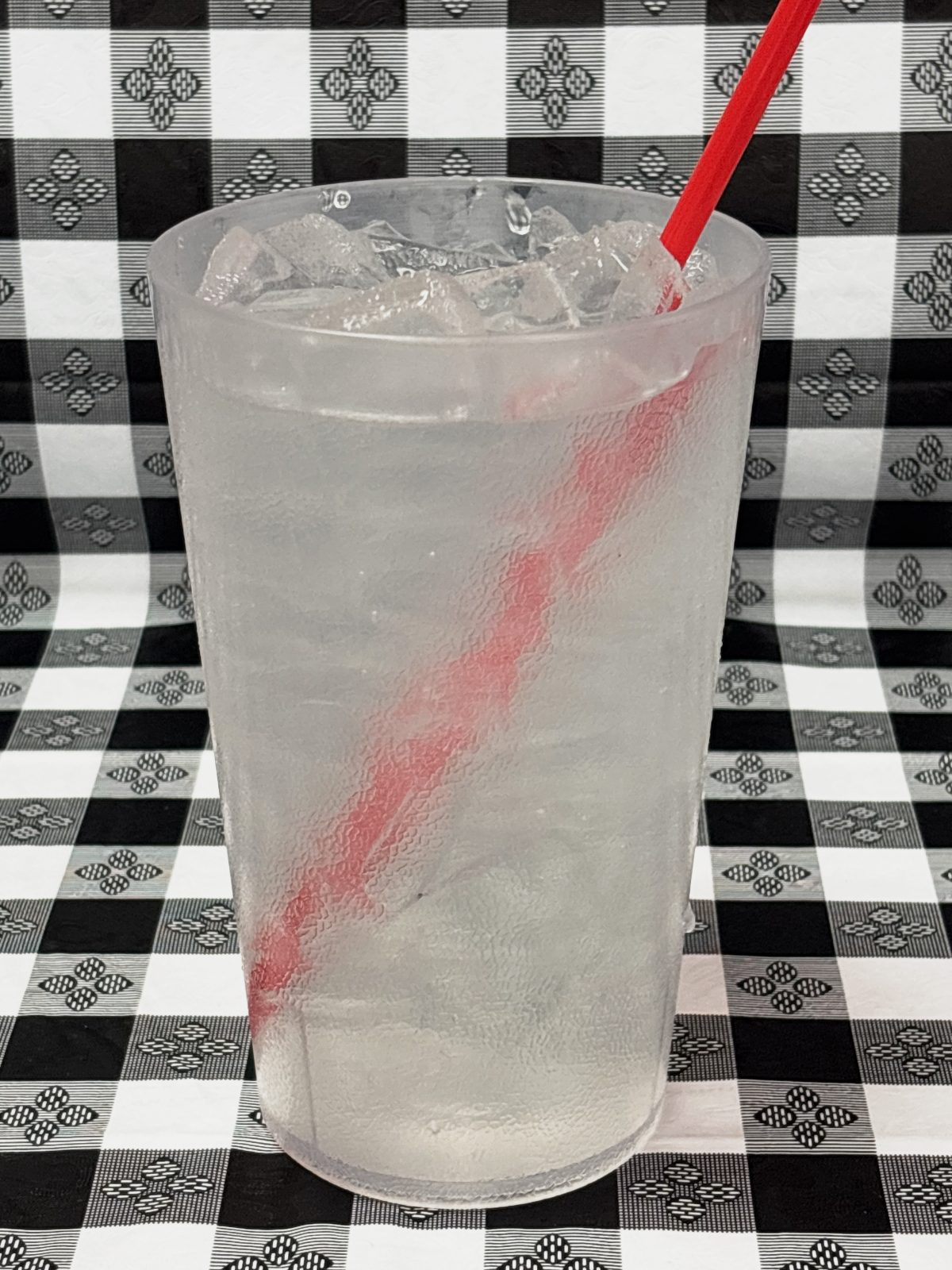 A large cup of limonada agua fresca